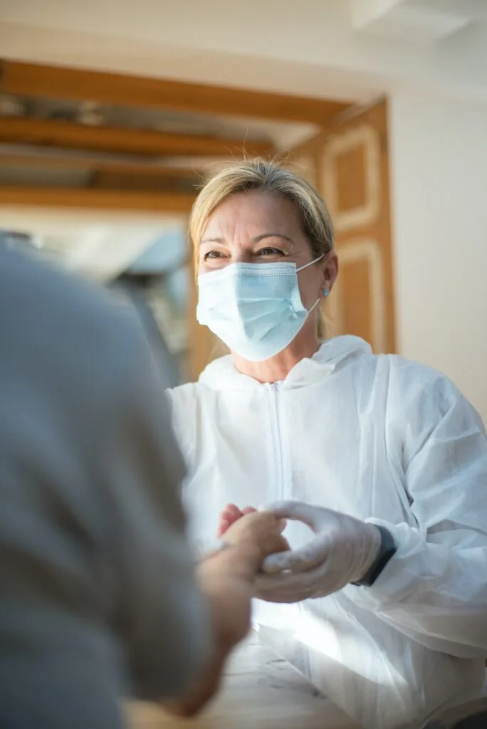 pexels-kampus-production-8949835 photo of nurse checking pulse of patient